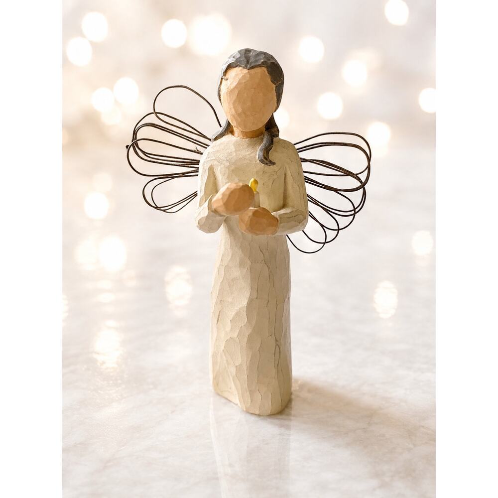 Willow Tree "Angel of Hope" figurine designed by Susan Lordi, featuring a cream